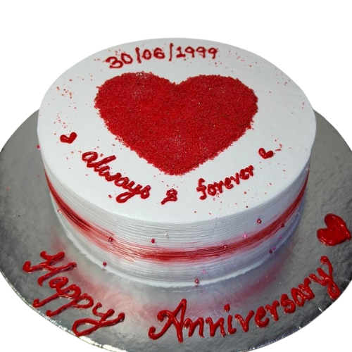 Anniversary cake with red heart design, white icing, Always & Forever message, and Happy Anniversary text.