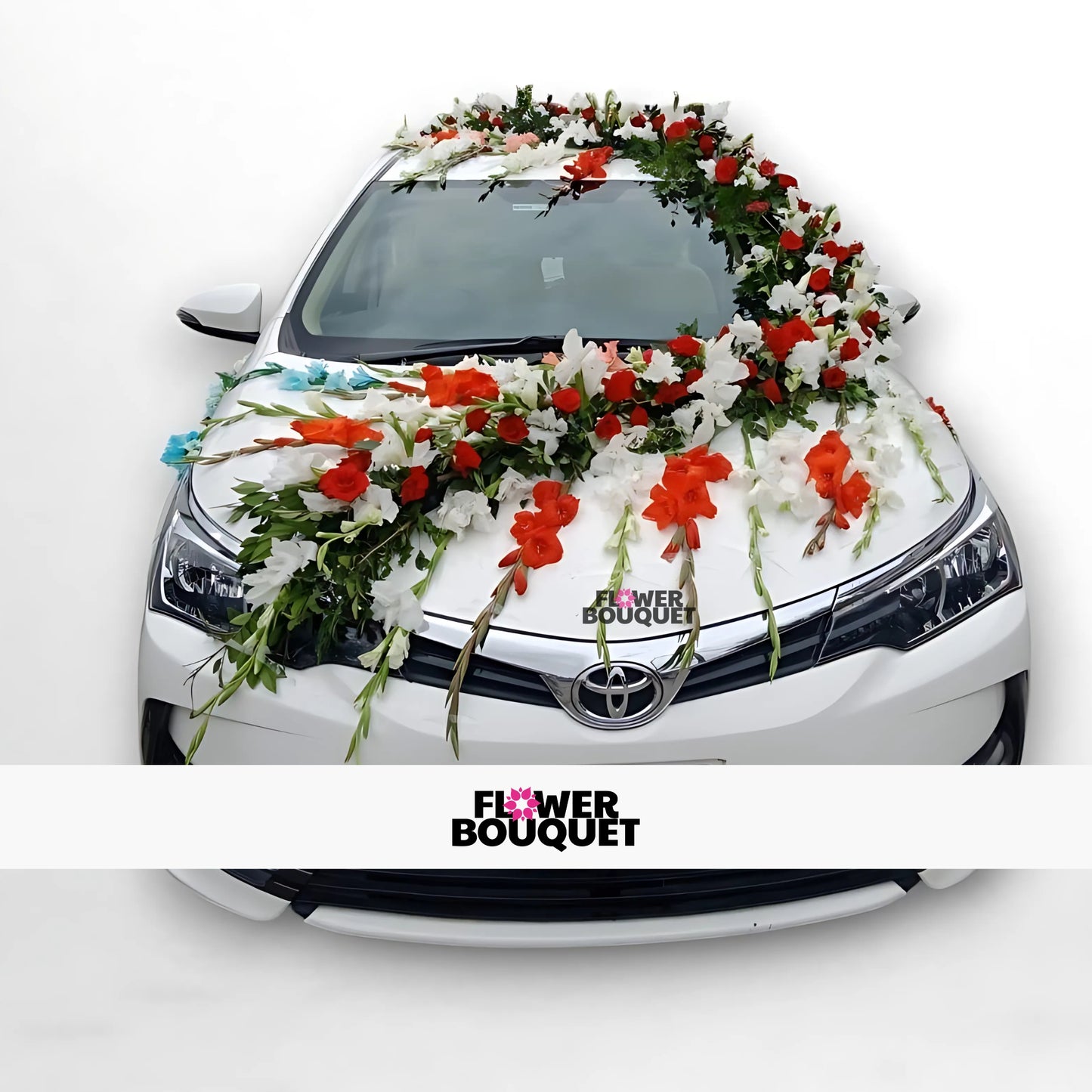 White car adorned with cascading red and white flower garlands, creating a beautiful wedding vehicle decoration.
