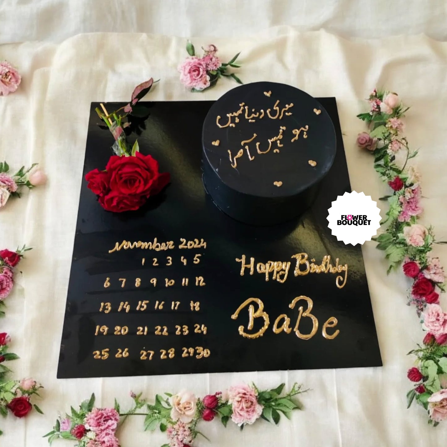 Elegant black and gold birthday cake with calligraphic design, red roses, and personalized message - a sophisticated and romantic celebration of a special someone.