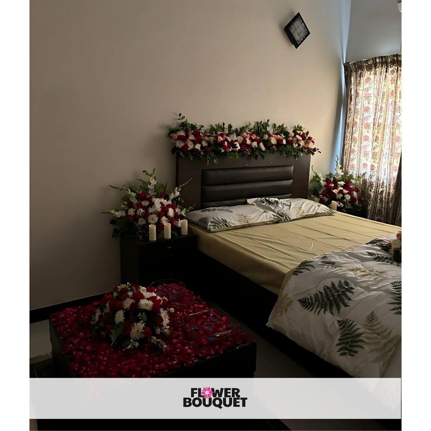 Enchanted Bloom Canopy Bed Decor with red and white flowers, green foliage, white drapes, string lights, and rose petals.