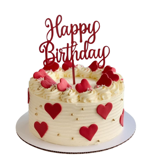 Fresh cream birthday cake decorated with red fondant hearts, golden pearls, and a “Happy Birthday” topper.