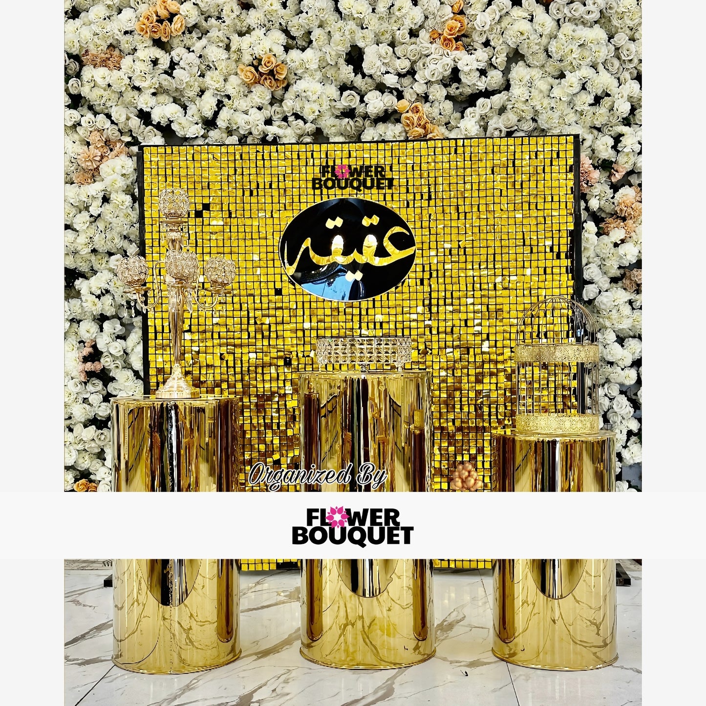 Luxurious event display by Flower Bouquet featuring a golden sequin backdrop with Arabic calligraphy, three golden pedestals with ornate decorations, and surrounded by white and cream flowers, creating an opulent and sophisticated atmosphere