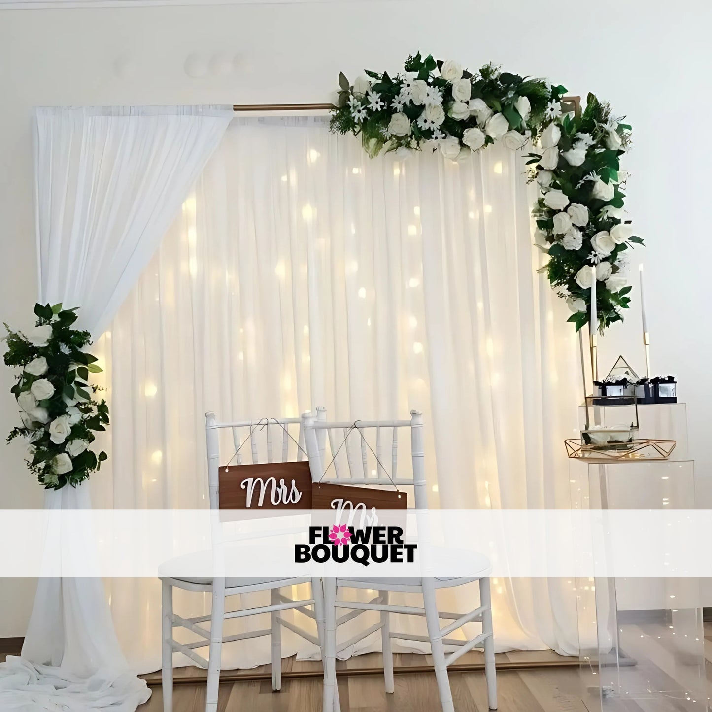 Minimalist white Nikah stage with floral arch and warm lighting.