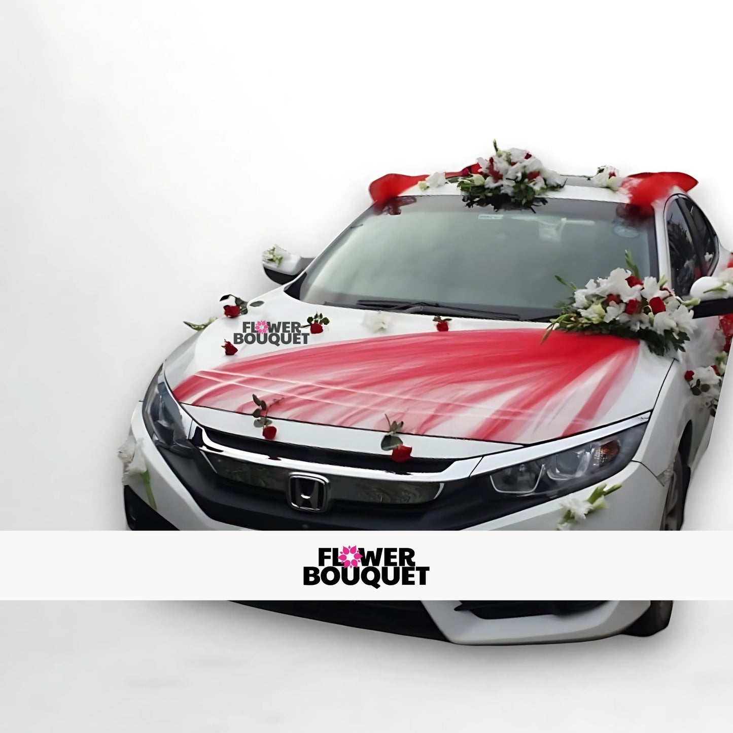 White car decorated with red and white flowers and red fabric.