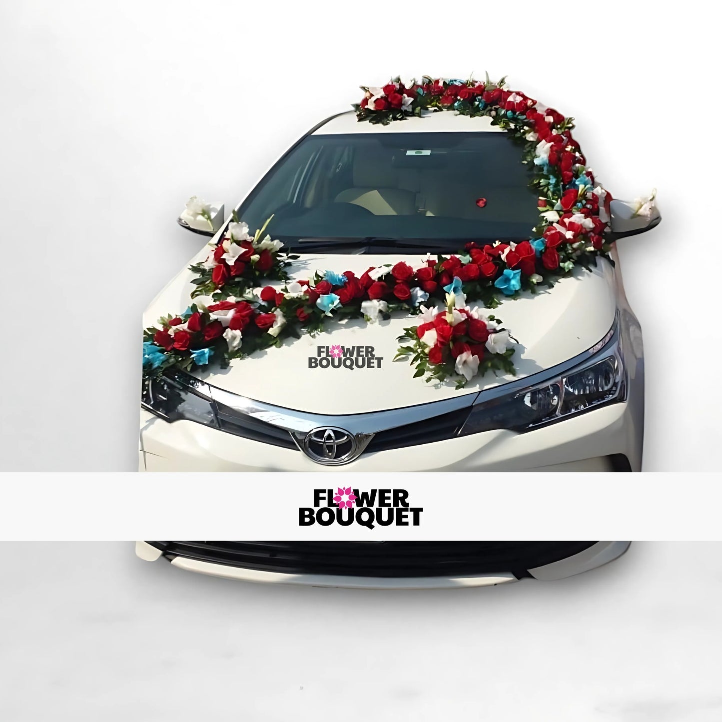 White car decorated with red and white flowers and red fabric.