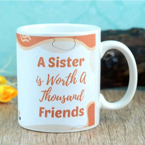 White ceramic mug with “A Sister is Worth a Thousand Friends” printed quote