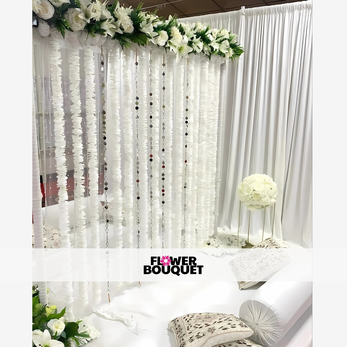 White Nikah canopy with floral garlands and elegant drapes.