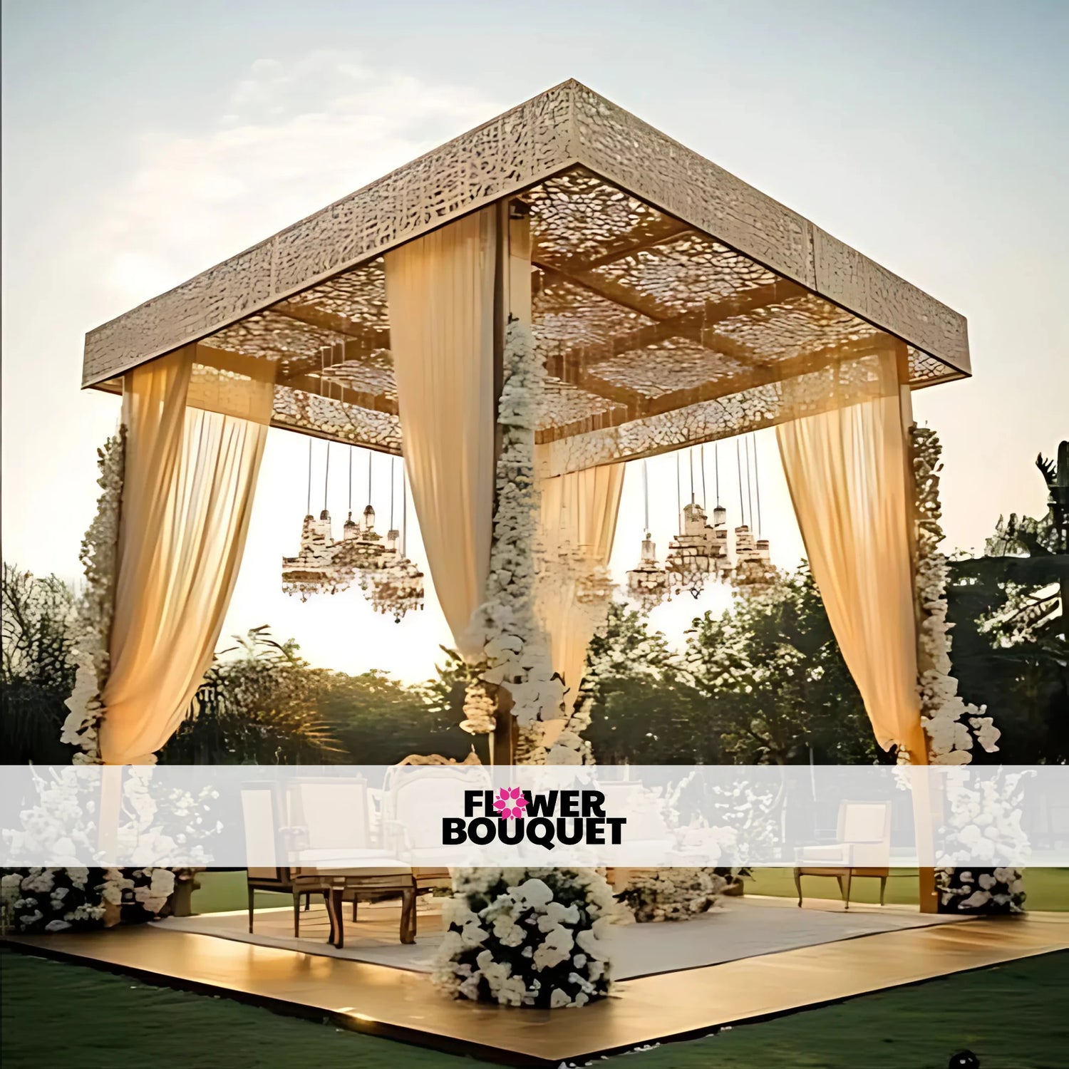 A stunning Walima decoration setup featuring a white and gold theme. The stage includes an ornate upholstered sofa, a floral backdrop with pastel roses and lilies, elegant draped curtains, and soft fairy lights. 