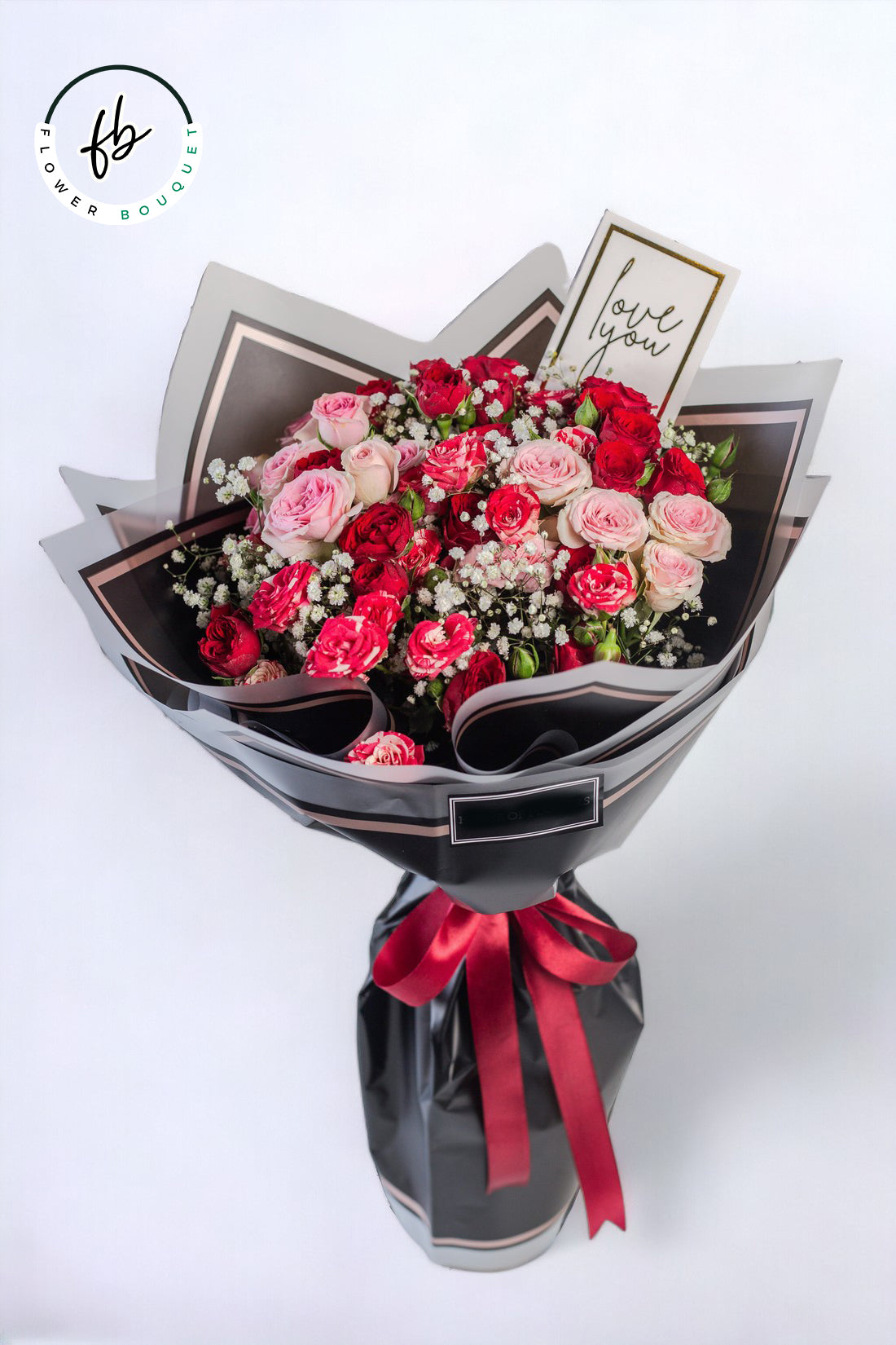 Black flower bouquet with red and pink roses including baby breath with love you card