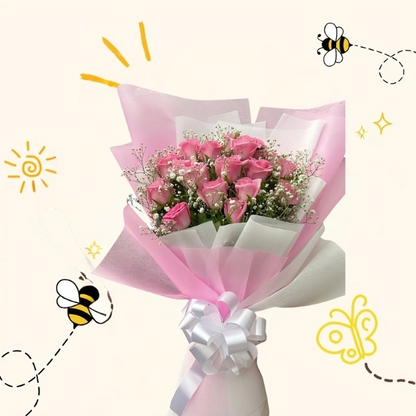 A beautiful hand-held bouquet featuring fresh cream-yellow roses and white baby's breath wrapped in decorative white butterfly paper with a pink ribbon.