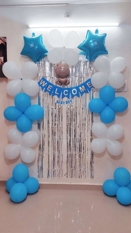 Baby Shower Decoration Set with blue and white balloons, silver backdrop, and Welcome Baby Boy banner in Pakistan