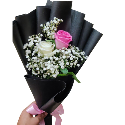 Blush Grace Bouquet with pink and white roses, baby’s breath, black wrapping, and pink ribbon – elegant floral gift for romantic and special occasions.
