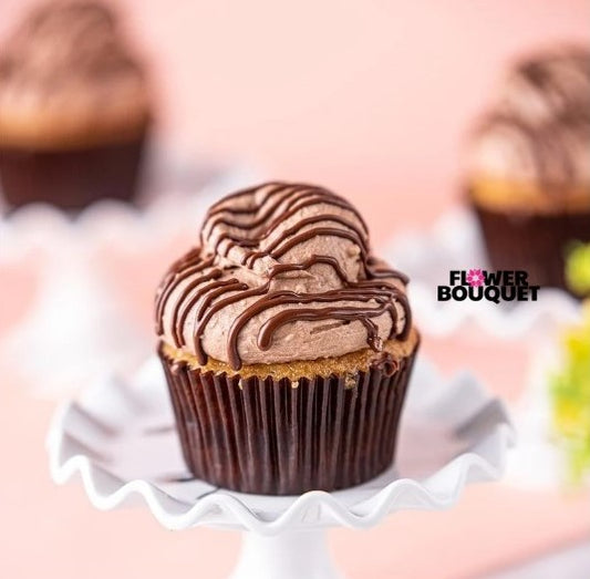 A rich chocolate cupcake topped with creamy chocolate frosting and a drizzle of decadent chocolate glaze, perfect for dessert lovers.