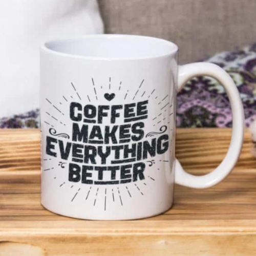 White ceramic mug with “Coffee Makes Everything Better” quote in bold black font