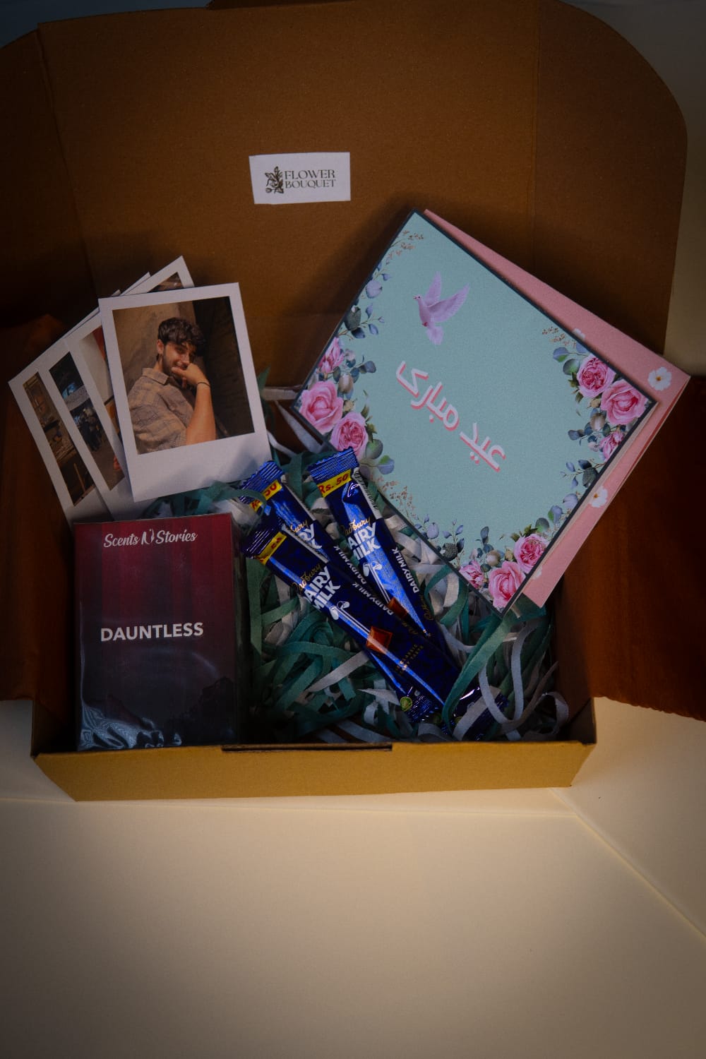 Eid gift box for boys with Scents N Stories perfume, chocolates, and floral Eid card