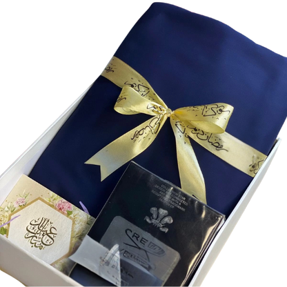 Elegant Eid gift box with unstitched cotton suit, chain watch, and greeting card