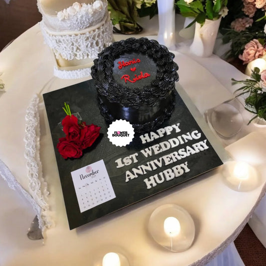 Elegant black and white wedding anniversary cake with lace-like design, red roses, and personalized message - a sophisticated and romantic celebration of love.