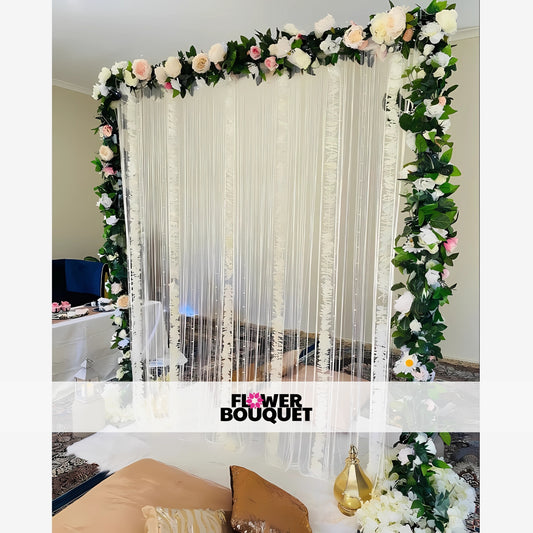 A beautifully decorated floral backdrop with white and pink flowers, perfect for special events.