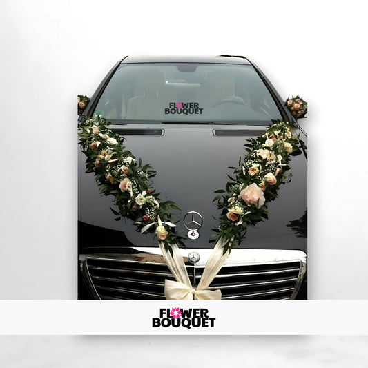 Gray Mercedes-Benz decorated with V-shaped floral garland of pink and white flowers for weddings, Flower Bouquet logo visible.