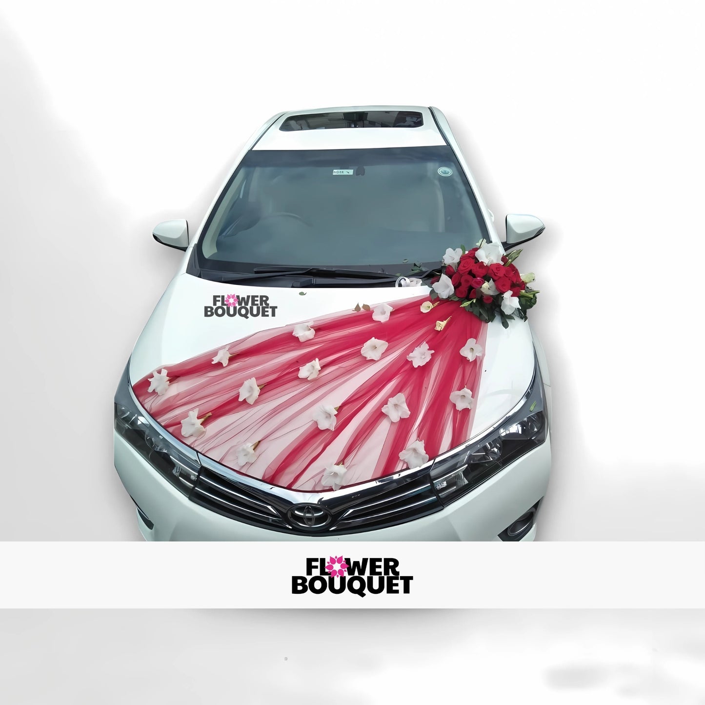 White car decorated with red and white flowers and red fabric.