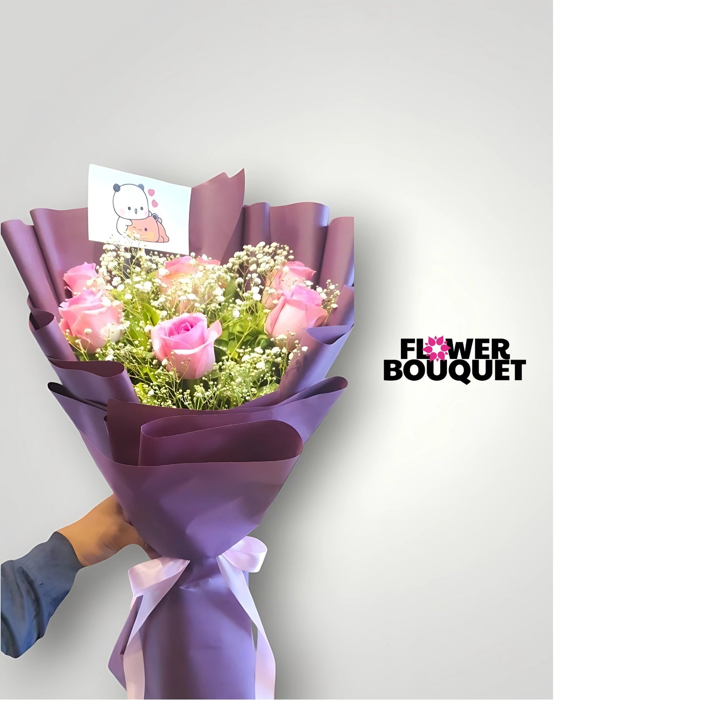 Enchanted pink rose bouquet with baby's breath, wrapped in elegant purple paper, tied with a white ribbon, and featuring a cartoon card.