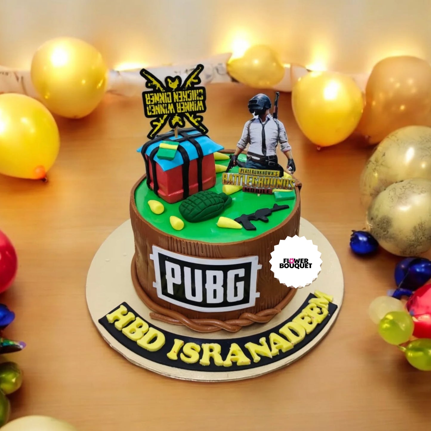 Vibrant, multi-game themed birthday cake featuring PUBG, Fortnite, Minecraft, and League of Legends elements, with a gamer figurine in VR headset - a celebration of the gaming enthusiast's passions.