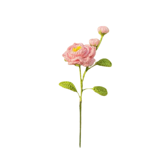 Handmade crochet camellia flower with two pink buds and green leaves on a long stem.