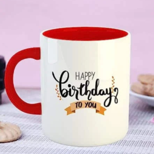 Red and white ceramic mug with “Happy Birthday to You” printed design