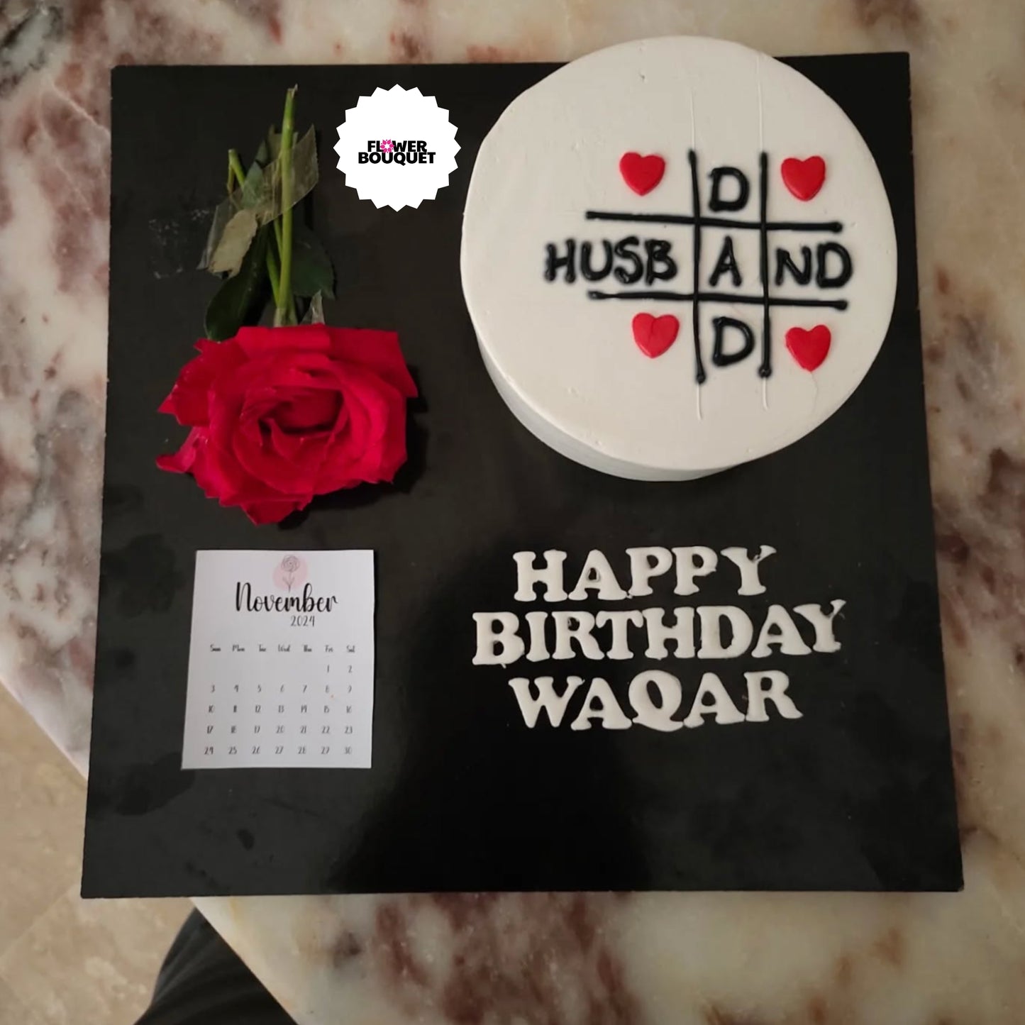 Birthday cake with tic-tac-toe heart design, "HUSBAND" text, red rose, and November calendar - celebrating a special loved one's birthday