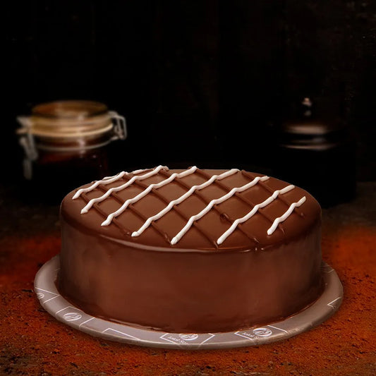 "Jlal Sons JS Chocolate Chess Mousse Cake with lattice design, available for delivery in Lahore, Karachi, and Islamabad"