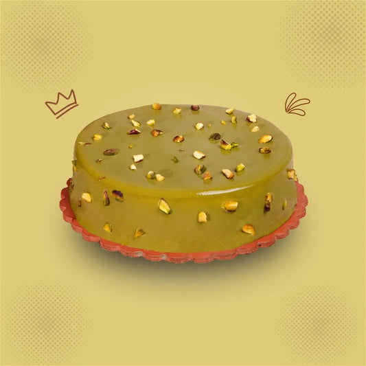 "Jlal Sons Premium Pistachio Milk Cake topped with pistachio glaze and nuts, available in Lahore, Karachi, and Islamabad"