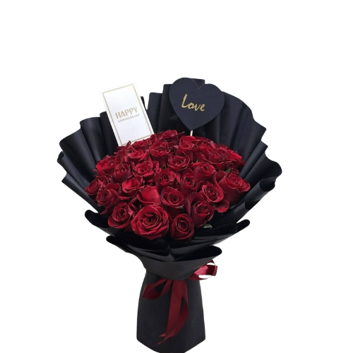 Large bouquet of red roses in black fan wrap with love tag and card