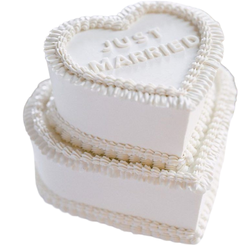 Layered white heart-shaped wedding cake with “Just Married” message