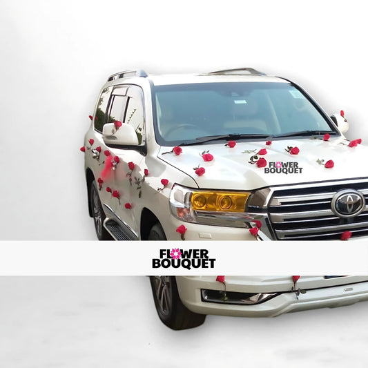 White SUV decorated with red roses on the hood, side mirrors, and doors.