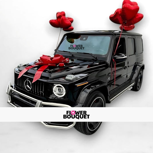 Black Mercedes-Benz G-Class decorated with red bow and heart-shaped balloons for weddings, Flower Bouquet logo visible.