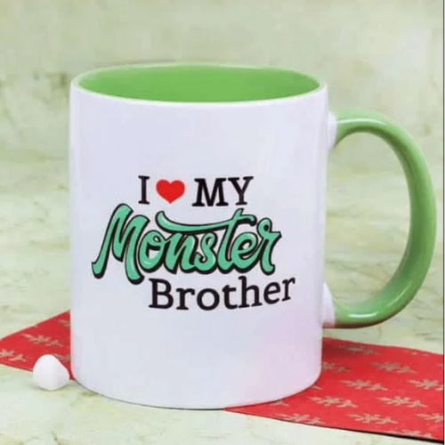 Green and white ceramic mug with “I love my Monster Brother” printed quote