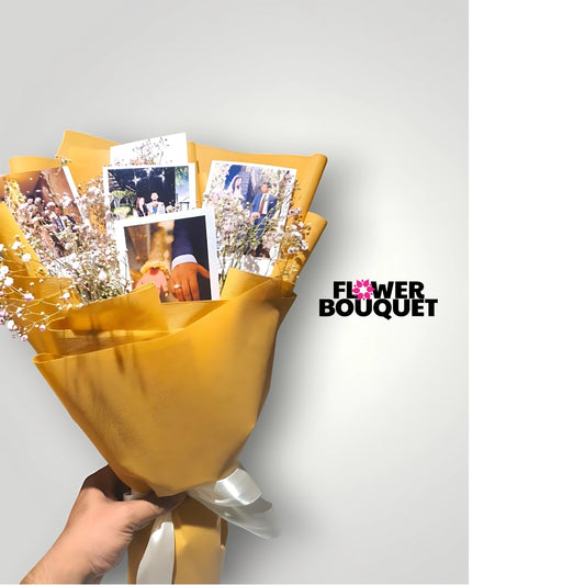 A beautifully wrapped golden bouquet featuring delicate baby's breath flowers and personalized photo prints, perfect for weddings, anniversaries, or heartfelt gifts.