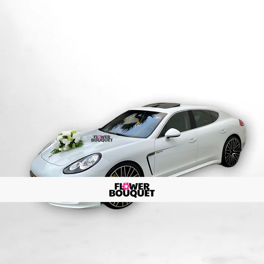 White Porsche Panamera with elegant white floral arrangement on hood for weddings, Flower Bouquet logo visible.