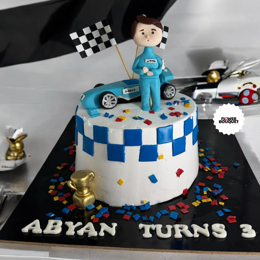 Racing-themed birthday cake with blue checkered pattern, toy race car and Driver For Children