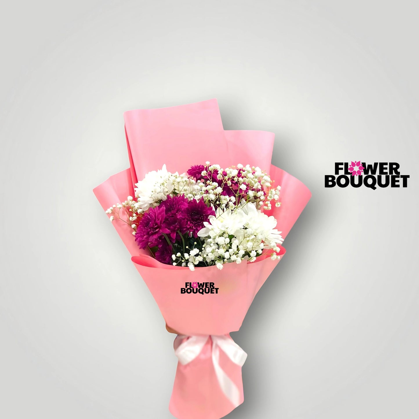 A vibrant and colorful bouquet featuring lush fuchsia chrysanthemums and delicate white daisies, wrapped in a soft pink paper for a romantic and feminine presentation.