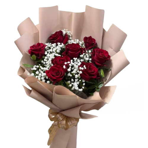 Red rose bouquet with baby’s breath wrapped in brown kraft paper and golden ribbon