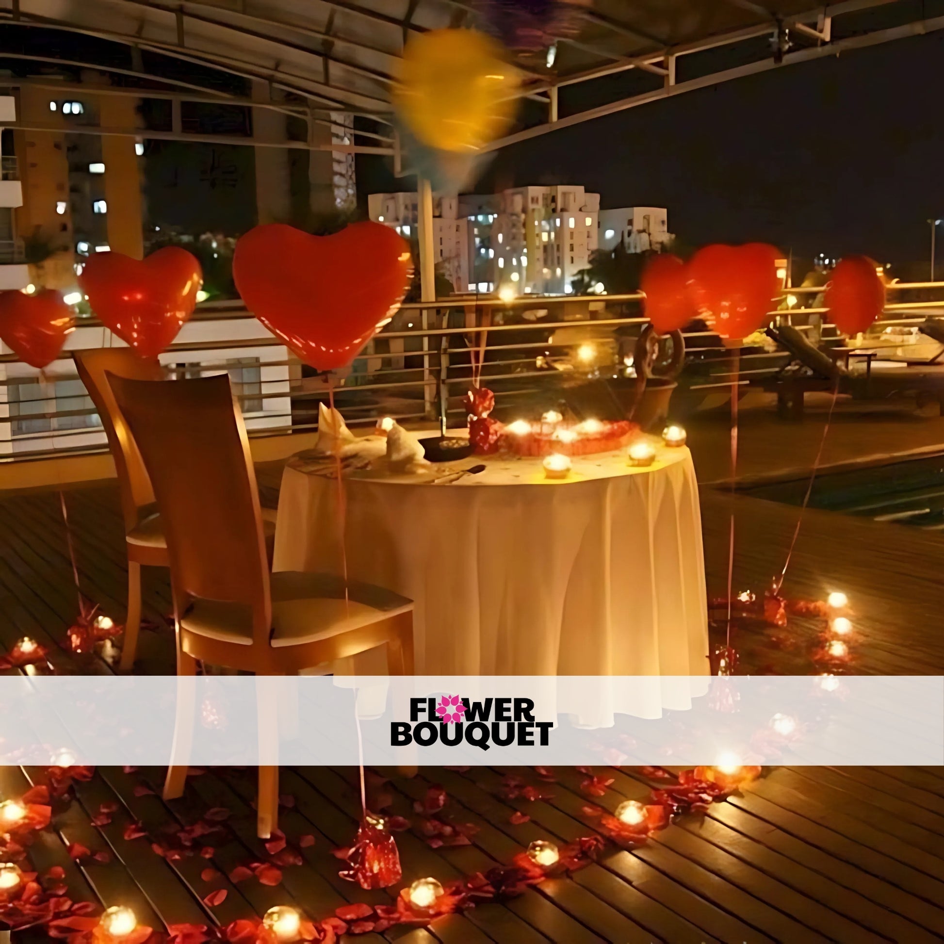 A romantic rooftop dinner setup with a table for two, surrounded by heart-shaped balloons, candles, and rose petals.