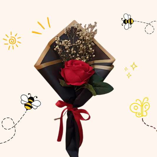 Solo Bloom bouquet with a single red rose and baby’s breath wrapped in black luxury paper with gold trim and red satin ribbon — same-day delivery in Pakistan.