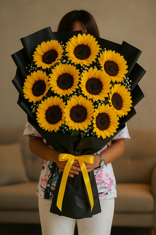 Stunning bouquet of 11 sunflowers with baby’s breath wrapped in black paper and yellow ribbon – ideal for birthdays and flower delivery in Pakistan