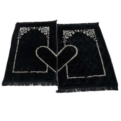 Elegant black velvet couple prayer mats with heart-shaped embroidery, perfect Islamic gift set for weddings and Eid.
