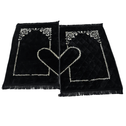 Elegant black velvet couple prayer mats with heart-shaped embroidery, perfect Islamic gift set for weddings and Eid.
