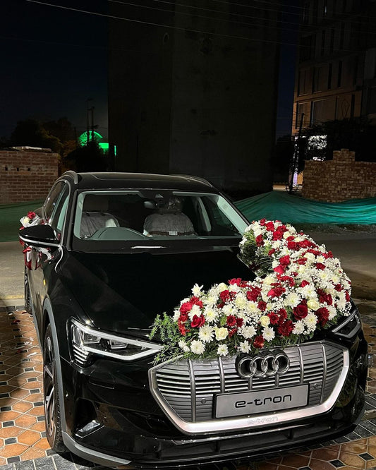 black audi e-tron wedding decor by  flower bouquet