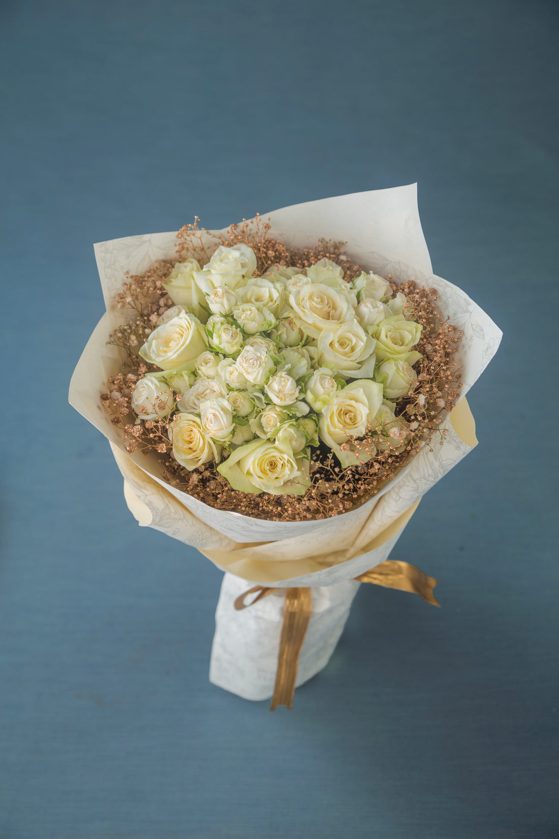 white roses fresh flower bouquet, with white wrapping  