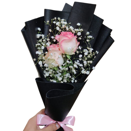 soft pink imported roses with baby’s breath, wrapped in matte black paper and pink ribbon – delicate floral bouquet.